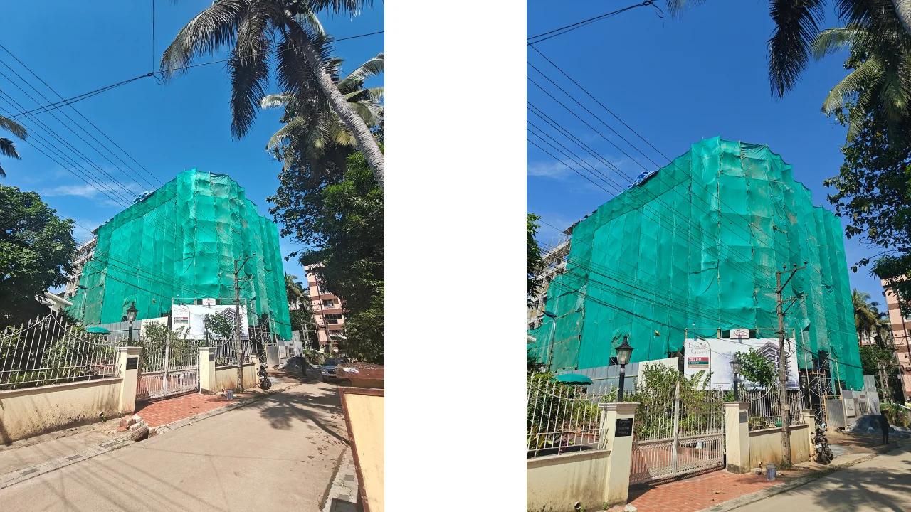 Real construction photo of Land Trades Laxmi Govind project showing current building status with green safety net coverage